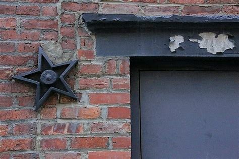 what are the metal stars on houses|old house metal star meaning.